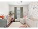 Bright Bedroom with white crib, stylish shelving, and floral wallpaper feature at 1338 Dupont Nw Park, Atlanta, GA 30318