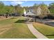 Grassy community space with covered seating, walking path and mature trees at 1338 Dupont Nw Park, Atlanta, GA 30318