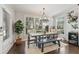 Dining room with large windows, stylish chandelier, and elegant table setting at 1338 Dupont Nw Park, Atlanta, GA 30318