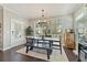 Dining area with large windows, a rustic dining table, and decorative accents at 1338 Dupont Nw Park, Atlanta, GA 30318