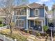 Charming two-story home with a covered front porch and well-manicured landscaping at 1338 Dupont Nw Park, Atlanta, GA 30318