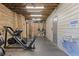 Community gym with weight machines, water fountain, and exposed ceiling at 1338 Dupont Nw Park, Atlanta, GA 30318