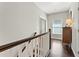 Second floor hallway with wood floors and a hallway closet at 1338 Dupont Nw Park, Atlanta, GA 30318