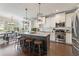 Modern kitchen featuring white cabinets, stainless steel appliances, and a granite-topped island with seating at 1338 Dupont Nw Park, Atlanta, GA 30318