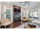 Bright living room featuring a fireplace, large windows, and hardwood flooring at 1338 Dupont Nw Park, Atlanta, GA 30318