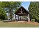 Open-air pavilion with a picnic table, offering a shaded space for outdoor activities at 1338 Dupont Nw Park, Atlanta, GA 30318