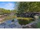 Scenic community pond with rock borders and lush greenery, offering a tranquil natural setting at 1338 Dupont Nw Park, Atlanta, GA 30318