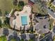 Overhead shot of a community pool and clubhouse with parking and landscaping at 1338 Dupont Nw Park, Atlanta, GA 30318