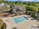Aerial view of a community pool and clubhouse with well-maintained landscaping at 1338 Dupont Nw Park, Atlanta, GA 30318