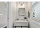 Modern powder room with sleek vanity, updated lighting, and contemporary finishes at 1338 Dupont Nw Park, Atlanta, GA 30318