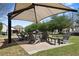Comfortable outdoor seating area under a shade structure, perfect for relaxing at 1338 Dupont Nw Park, Atlanta, GA 30318