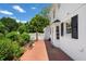 Beautiful backyard with a brick patio, manicured greenery, and elegant landscaping at 2580 Hyde Manor Dr, Atlanta, GA 30327