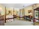Charming bedroom featuring two four-poster beds, floral accents, and natural light at 2580 Hyde Manor Dr, Atlanta, GA 30327
