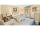 Calm bedroom featuring a queen-sized bed, natural light, and soft neutral tones at 2580 Hyde Manor Dr, Atlanta, GA 30327