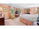 Comfortable main bedroom with carpet, light peach walls, and natural light from surrounding windows at 2580 Hyde Manor Dr, Atlanta, GA 30327