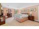 Spacious bedroom featuring two windows for natural light, and warm peach colored walls at 2580 Hyde Manor Dr, Atlanta, GA 30327