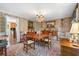 Formal dining room featuring a wooden table with chairs, and decorative wallpaper at 2580 Hyde Manor Dr, Atlanta, GA 30327