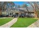 Charming home featuring a landscaped front yard and stone walkway, complete with a quaint design at 2580 Hyde Manor Dr, Atlanta, GA 30327