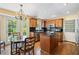 Eat-in kitchen featuring hardwood floors, black counters, and a breakfast nook with natural light at 2580 Hyde Manor Dr, Atlanta, GA 30327