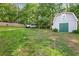 Spacious backyard with a white truck, a shed, and ample green space enclosed by a wooden fence at 39 Cannon Pl, Dallas, GA 30157