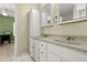 Bathroom with double sink vanity, white cabinets, updated faucets, and tiled floors at 39 Cannon Pl, Dallas, GA 30157