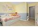 This bedroom is stylish with light hardwood floors and a trundle bed with built-in storage at 39 Cannon Pl, Dallas, GA 30157