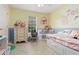 This cozy bedroom features light hardwood floors, colorful decor, and a trundle bed with built-in storage at 39 Cannon Pl, Dallas, GA 30157
