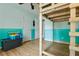 This bedroom includes a lofted bed with ladder, laminate floors, and natural light at 39 Cannon Pl, Dallas, GA 30157