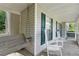 Charming front porch with a porch swing and rocking chairs, perfect for enjoying the outdoors at 39 Cannon Pl, Dallas, GA 30157
