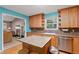 Stylish kitchen with stainless appliances, a functional island, and a seamless flow into the adjacent living area at 39 Cannon Pl, Dallas, GA 30157