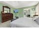Spacious main bedroom with modern decor, a large dresser, and a ceiling fan for added comfort at 39 Cannon Pl, Dallas, GA 30157