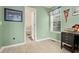 Functional office area next to main bathroom, featuring laminate flooring, a window, and comfortable lighting at 39 Cannon Pl, Dallas, GA 30157