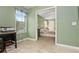 Office featuring views of a large main bedroom, wood floors, and natural light at 39 Cannon Pl, Dallas, GA 30157