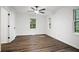 Bright bedroom with ceiling fan and hardwood floors at 6032 Lakeshore Se Dr, Mableton, GA 30126