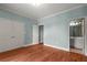 This bedroom features hardwood floors, an ensuite bathroom, and double closets at 7940 Gable Dr, Douglasville, GA 30135