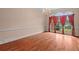Elegant dining room featuring hardwood floors and windows that offer plenty of natural light at 7940 Gable Dr, Douglasville, GA 30135
