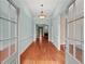 Inviting foyer features hardwood floors, elegant lighting, and glass paneled doors at 7940 Gable Dr, Douglasville, GA 30135