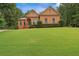 Beautiful brick home with manicured lawn and mature trees in a desirable neighborhood at 7940 Gable Dr, Douglasville, GA 30135