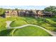 Estate featuring a golf green in backyard, lush landscaping, and an expansive layout at 878 Middle Fork Trl, Suwanee, GA 30024