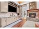 Wet bar area with granite countertops, built-in cabinets, fireplace and convenient amenities at 878 Middle Fork Trl, Suwanee, GA 30024