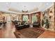 Spacious finished basement featuring a stone fireplace, entertainment area, and access to the outdoors at 878 Middle Fork Trl, Suwanee, GA 30024