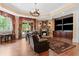 An inviting basement area with a stone fireplace, TV area, and large area rug for cozy evenings and relaxation at 878 Middle Fork Trl, Suwanee, GA 30024