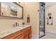 Bathroom sink with a stone countertop and a mirror, with a glass enclosed shower at 878 Middle Fork Trl, Suwanee, GA 30024