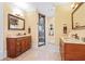 Bathroom with double sinks, two mirrors, and a glass enclosed shower at 878 Middle Fork Trl, Suwanee, GA 30024