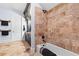 Tiled bathroom with a combination shower and tub at 878 Middle Fork Trl, Suwanee, GA 30024