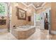 A soaking tub and walk-in shower accent this Primary bathroom at 878 Middle Fork Trl, Suwanee, GA 30024