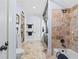 Tiled bathroom with a combination shower and tub at 878 Middle Fork Trl, Suwanee, GA 30024