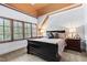Bedroom with dark furniture and window with shutters providing natural light at 878 Middle Fork Trl, Suwanee, GA 30024