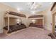 A bedroom offering four bunk beds, each with storage drawers and individual reading lights at 878 Middle Fork Trl, Suwanee, GA 30024