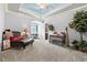 Charming bedroom featuring a unique cloud ceiling, plush seating, and ample natural light at 878 Middle Fork Trl, Suwanee, GA 30024